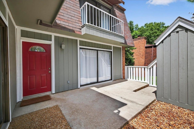 2965 N Shamrock, Tallahassee, FL 32309 - entrance to property featuring a balcony and board and batten siding