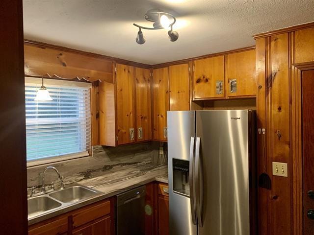 1915 Sunset Ln, Tallahassee, FL 32303 - kitchen featuring stainless steel fridge with ice dispenser, dishwashing machine, and brown cabinets