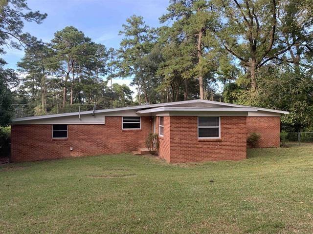 1915 Sunset Ln, Tallahassee, FL 32303 - rear view of house featuring brick siding