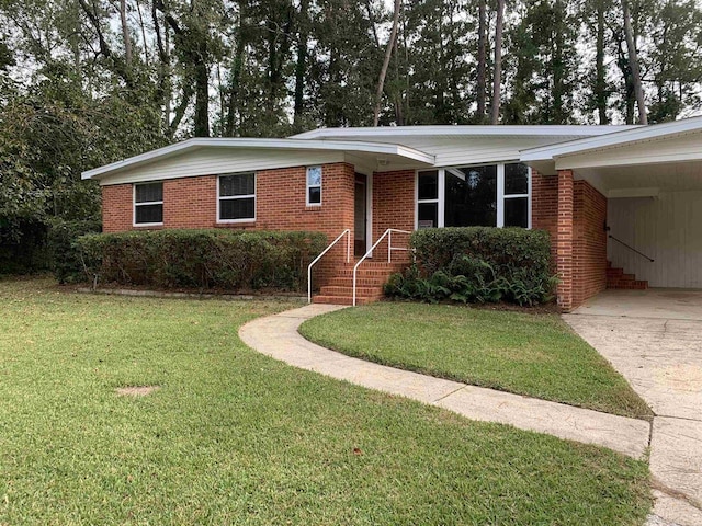 1915 Sunset Ln, Tallahassee, FL 32303 - ranch-style home featuring a front yard, brick siding, and concrete driveway