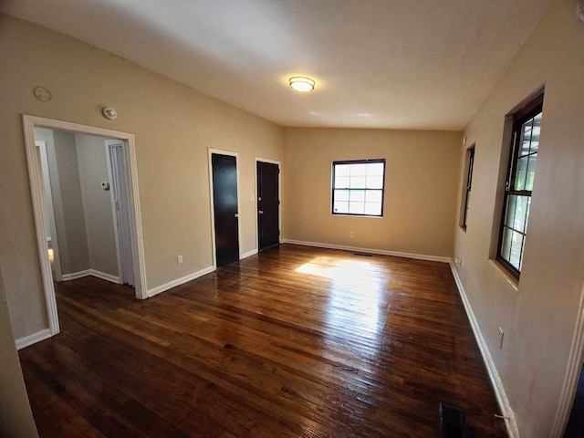 2031 Holmes St, Tallahassee, FL 32310 - empty room with dark wood finished floors and baseboards
