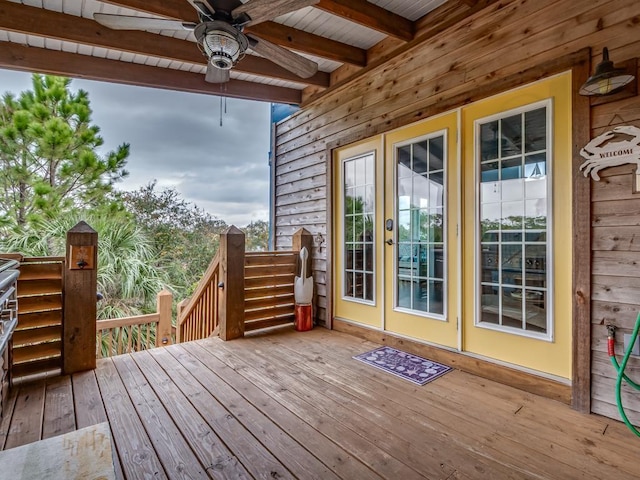641 Bald Point Rd, Alligator Point, FL 32346 - wooden terrace with french doors, ceiling fan, and stairway