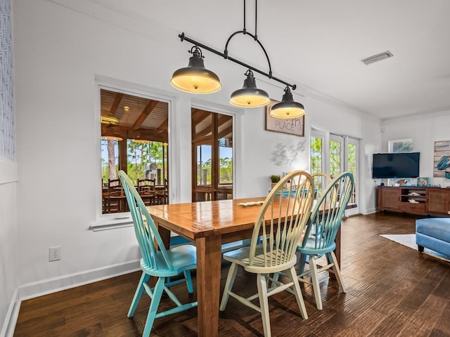 641 Bald Point Rd, Alligator Point, FL 32346 - dining space with dark wood-style flooring, baseboards, and french doors