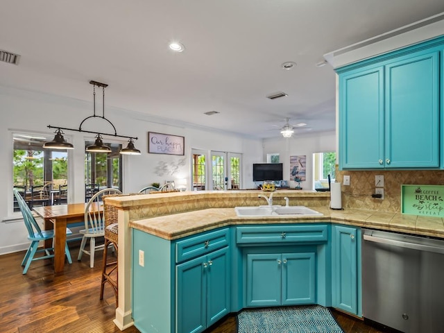 641 Bald Point Rd, Alligator Point, FL 32346 - kitchen with dishwasher, a sink, a peninsula, decorative backsplash, and recessed lighting