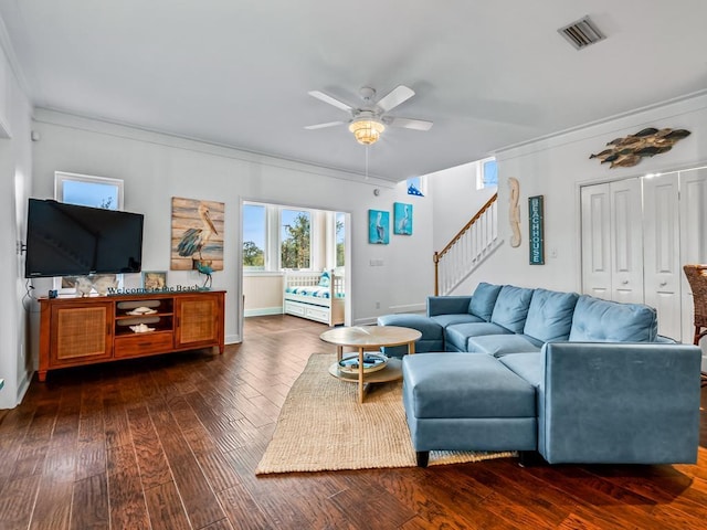 641 Bald Point Rd, Alligator Point, FL 32346 - living room featuring a ceiling fan, ornamental molding, stairs, dark wood finished floors, and baseboards