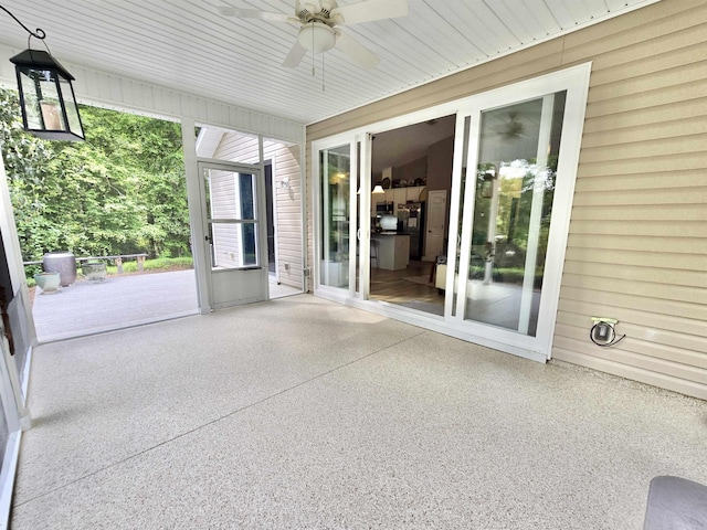 exterior space with a ceiling fan