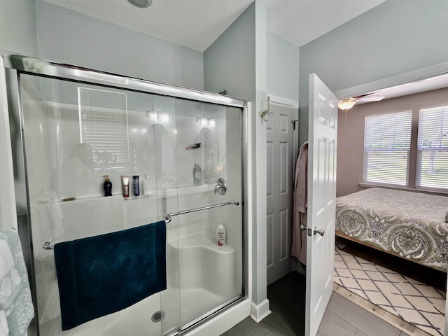 full bath with ceiling fan, tile patterned floors, a stall shower, and ensuite bathroom