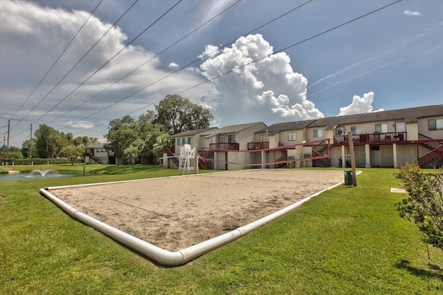 1317 Airport Dr Unit F12, Tallahassee, FL 32304 - view of community featuring a yard, a residential view, and volleyball court
