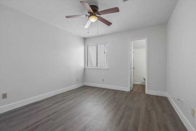 1317 Airport Dr Unit F12, Tallahassee, FL 32304 - unfurnished bedroom with baseboards, ceiling fan, wood finished floors, and ensuite bath