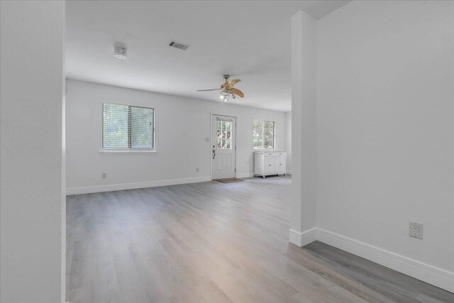 1317 Airport Dr Unit F12, Tallahassee, FL 32304 - empty room with baseboards, a ceiling fan, wood finished floors, and visible vents