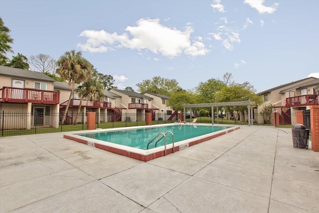 1317 Airport Dr Unit F12, Tallahassee, FL 32304 - pool featuring fence, a pergola, a patio area, and a residential view