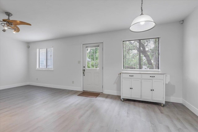 1317 Airport Dr Unit F12, Tallahassee, FL 32304 - entryway featuring baseboards, a ceiling fan, and light wood-style flooring