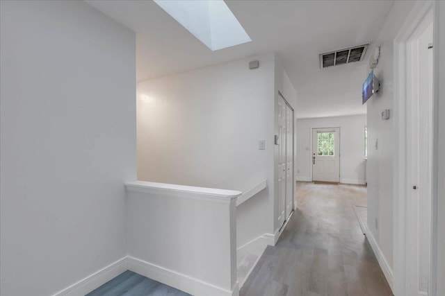 1317 Airport Dr Unit F12, Tallahassee, FL 32304 - hall with visible vents, baseboards, wood finished floors, and a skylight