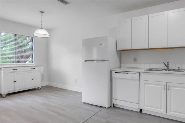 1317 Airport Dr Unit F12, Tallahassee, FL 32304 - kitchen featuring a sink, white cabinetry, white appliances, and light countertops