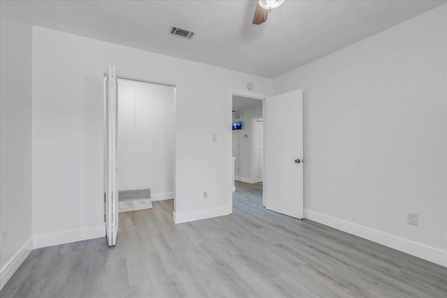 1317 Airport Dr Unit F12, Tallahassee, FL 32304 - unfurnished bedroom with visible vents, baseboards, wood finished floors, and a closet