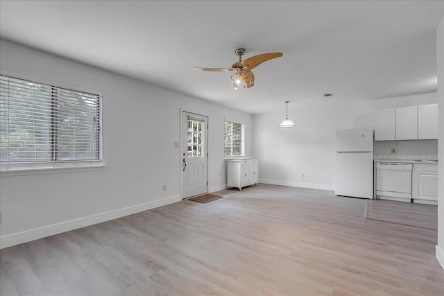 1317 Airport Dr Unit F12, Tallahassee, FL 32304 - unfurnished living room with baseboards, ceiling fan, and light wood-style flooring