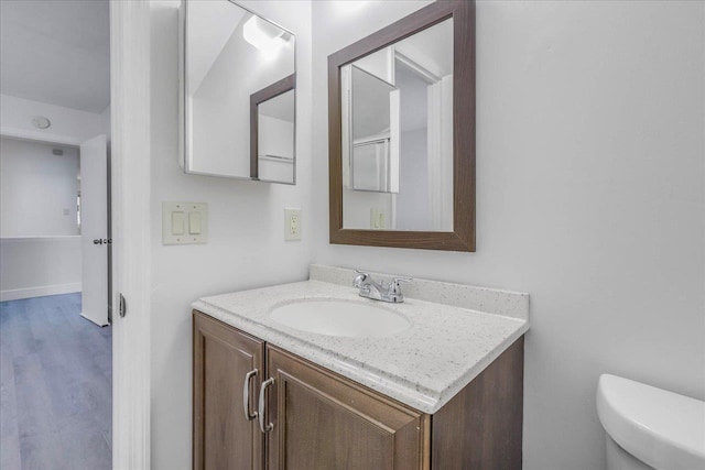 1317 Airport Dr Unit F12, Tallahassee, FL 32304 - half bath with vanity, toilet, and wood finished floors