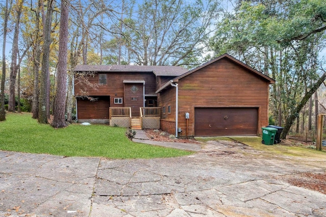 view of front facade featuring a wooden deck, a garage, and a front lawn