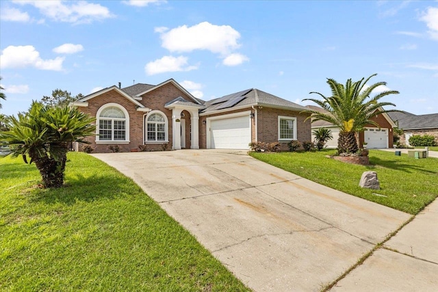 ranch-style house with a garage and a front yard