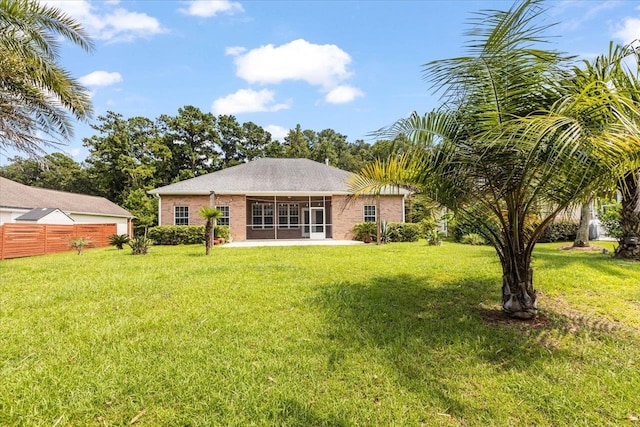 rear view of house with a lawn