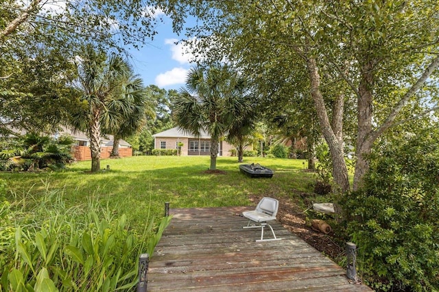 view of yard featuring a wooden deck