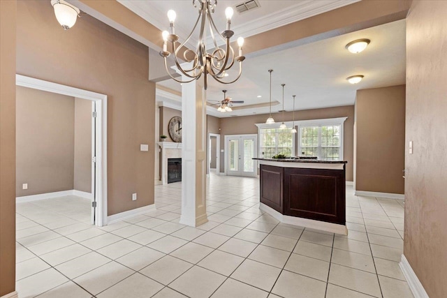 kitchen with a kitchen island, decorative light fixtures, light tile patterned floors, dark brown cabinets, and ceiling fan