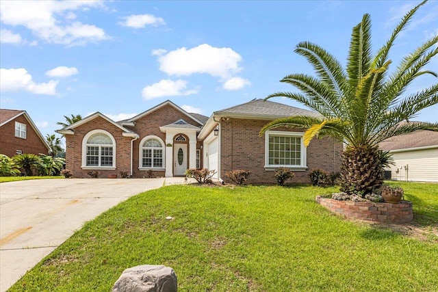 single story home with a garage and a front yard