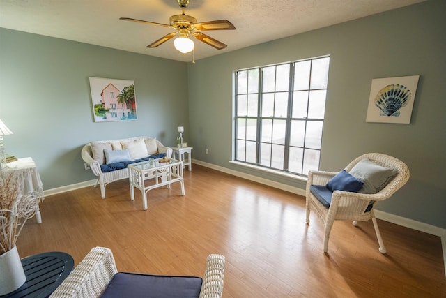 1553 Goodwood Dr, Tallahassee, FL 32308 - living room featuring wood finished floors, a ceiling fan, and baseboards