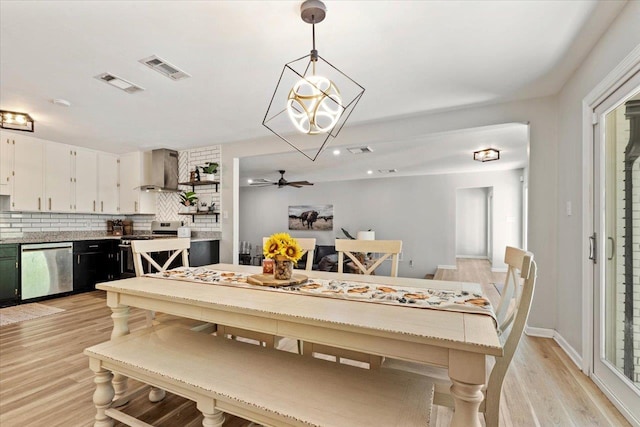 dining area featuring ceiling fan and light hardwood / wood-style floors