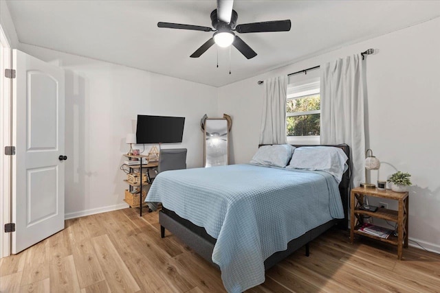 bedroom featuring hardwood / wood-style flooring and ceiling fan