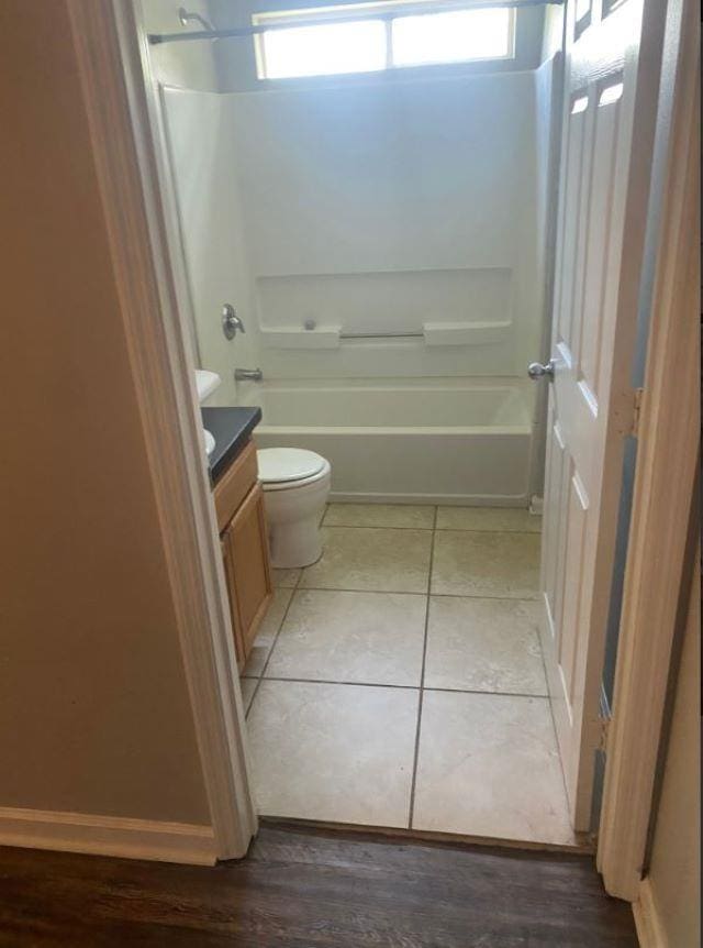 1417 Pullen Rd Unit 101, Tallahassee, FL 32303 - bathroom with vanity, toilet,  shower combination, and tile patterned floors