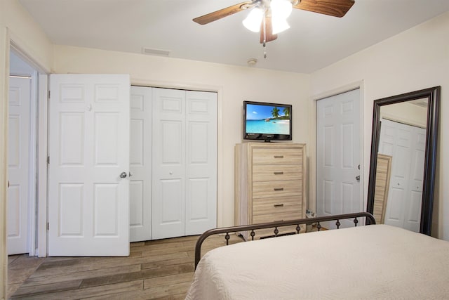 bedroom with wood finished floors and ceiling fan
