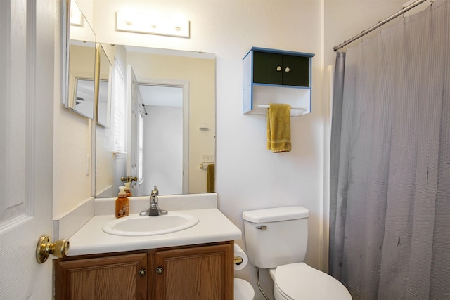 full bathroom with toilet, vanity, and a shower with curtain