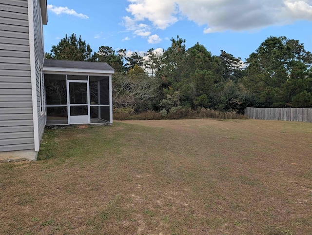 view of yard featuring a sunroom