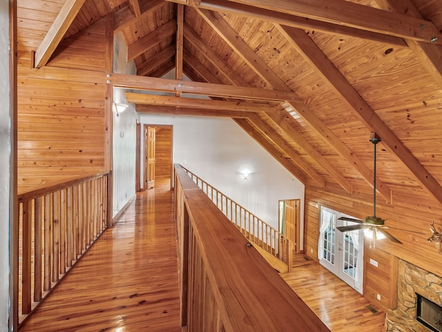 883 Hunters Trce, Crawfordville, FL 32327 - hall featuring hardwood / wood-style floors, wooden walls, wooden ceiling, and an upstairs landing