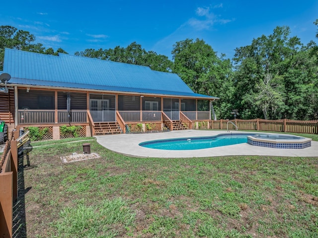 883 Hunters Trce, Crawfordville, FL 32327 - view of swimming pool featuring a sunroom, an in-ground hot tub, a fenced backyard, and stairs