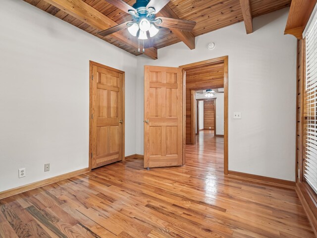 883 Hunters Trce, Crawfordville, FL 32327 - unfurnished bedroom with a wooden ceiling with exposed beams, light wood-style floors, and ceiling fan