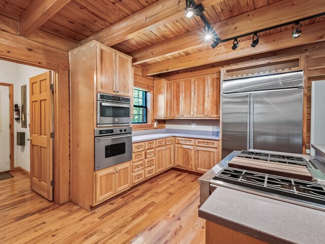 883 Hunters Trce, Crawfordville, FL 32327 - kitchen with appliances with stainless steel finishes, rail lighting, light wood-style flooring, light brown cabinets, and a wood ceiling with exposed beams