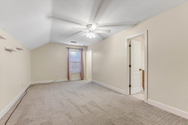 650 Mossy Oak Trl, Tallahassee, FL 32317 - empty room with a ceiling fan, light carpet, and vaulted ceiling