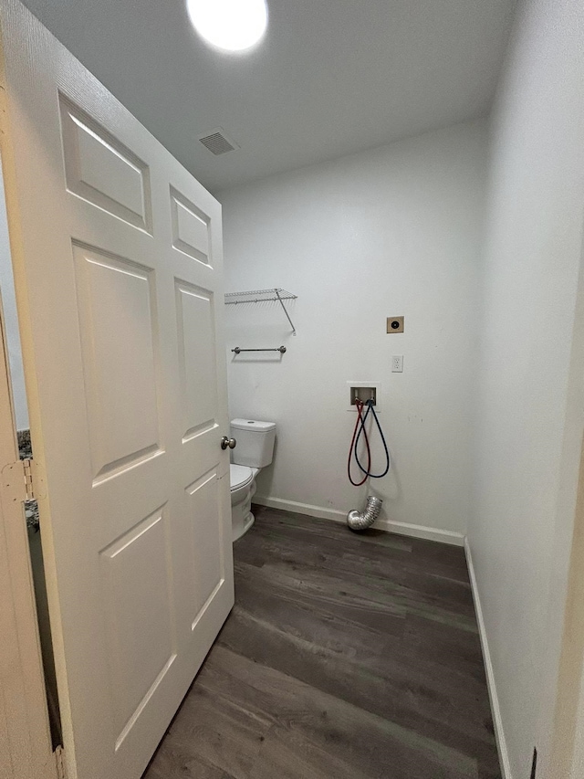 bathroom featuring baseboards, visible vents, toilet, and wood finished floors