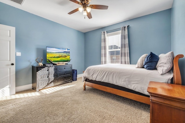 bedroom with carpet flooring, ceiling fan, visible vents, and baseboards