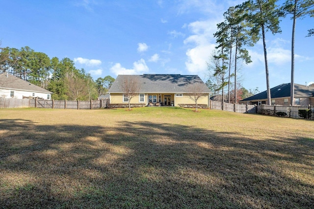 view of yard with a fenced backyard