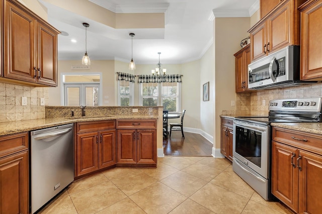 kitchen featuring a sink, stainless steel appliances, and brown cabinets