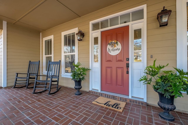 doorway to property with covered porch