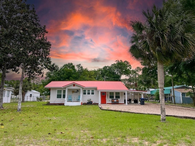 exterior space with a lawn and covered porch