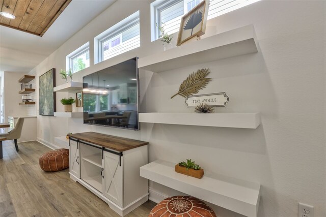 hall featuring wooden ceiling and light hardwood / wood-style flooring