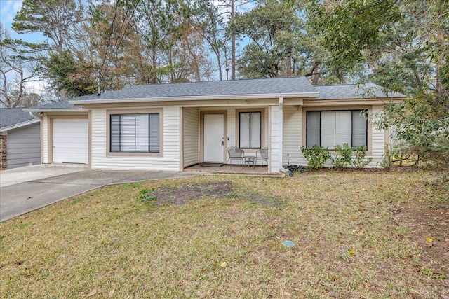 ranch-style home with a garage and a front yard