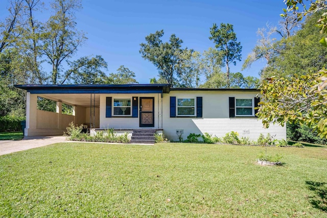 ranch-style house with a carport and a front lawn