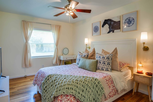 bedroom with hardwood / wood-style flooring and ceiling fan