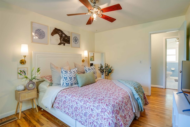 bedroom with hardwood / wood-style floors and ceiling fan